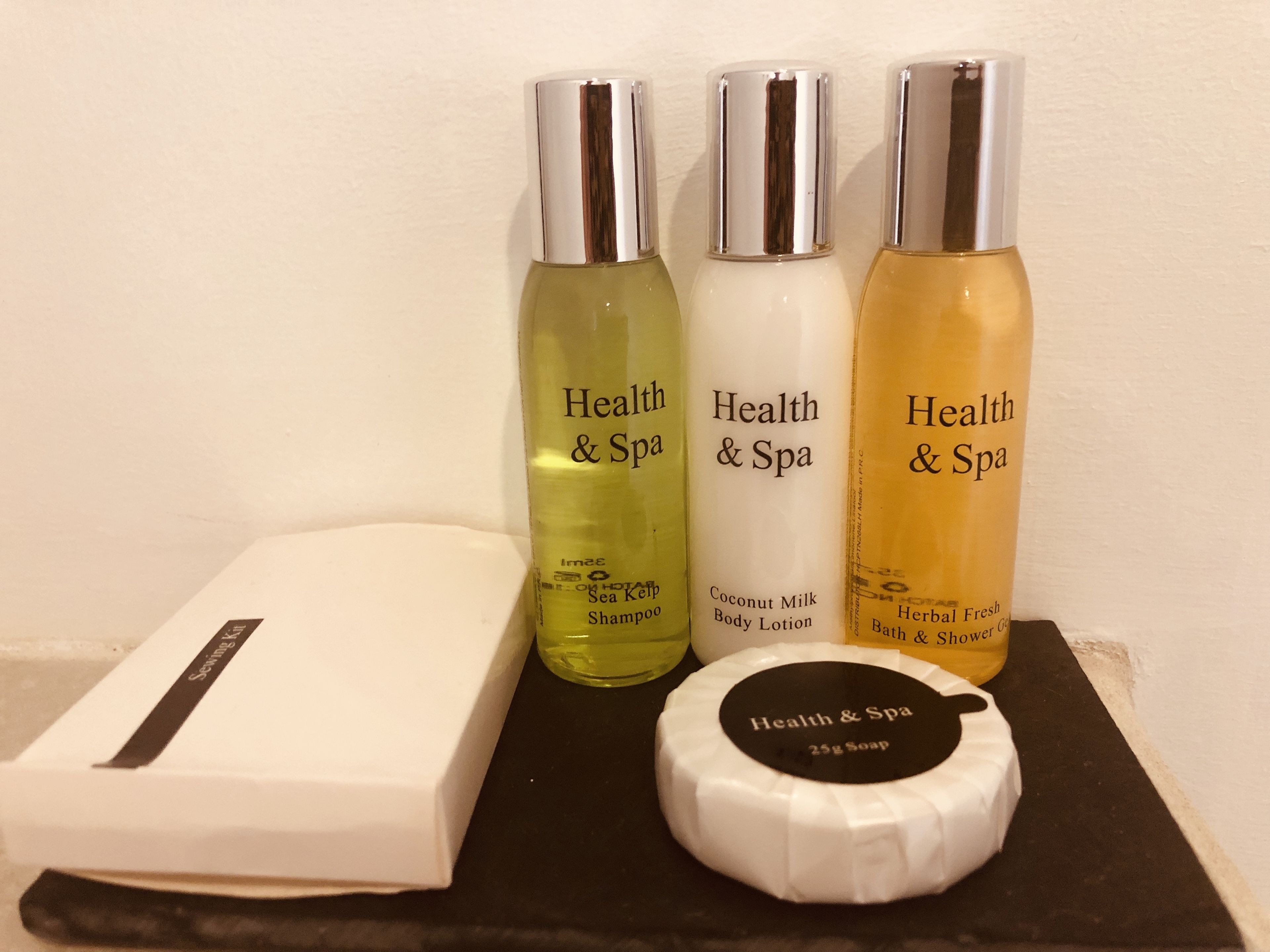 designer toiletries, hair dryer, bathrobes, slippers