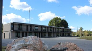A modern building with a flat roof and large windows.