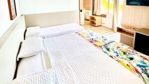 A hotel room with two beds, a television, and a view of the outdoors. - Xenius Hotel (João Pessoa)
