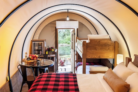 Conestoga Wagon | Premium bedding, free WiFi, bed sheets. Moose Creek Ranch