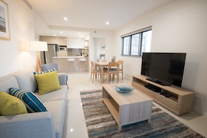 Two Bedroom Apartment | Living area | 50-inch flat-screen TV with digital channels, TV, Netflix