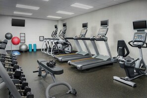 A gym with treadmills, dumbbells, and exercise balls. - Courtyard Muncie at Horizon Convention Center (Muncie)