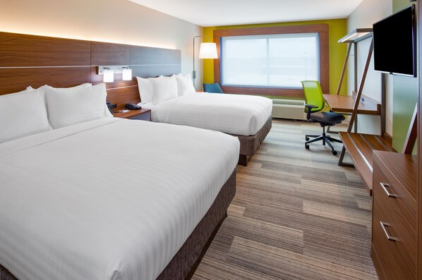 A hotel room with two beds, a desk, a chair, a TV, and a window with a view. - Holiday Inn Express & Suites Des Moines Downtown by IHG (Des Moines)
