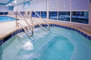 An indoor swimming pool with clear water, a no diving sign, and a pool ladder. - Holiday Inn Express & Suites Des Moines Downtown by IHG (Des Moines)