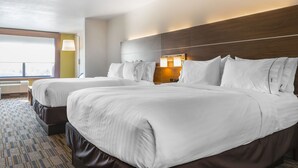 A hotel room with two beds, a large window, and a view of the city. - Holiday Inn Express & Suites Clarion by IHG (Clarion)