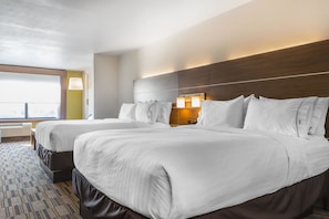 A hotel room with two beds, a large window, and a view of the city. - Holiday Inn Express & Suites Clarion by IHG (Clarion)