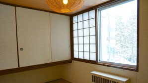 A traditional Japanese room with tatami flooring, shoji screens, and a large window. - Hotel Listel Inawashiro Main (Inawashiro)