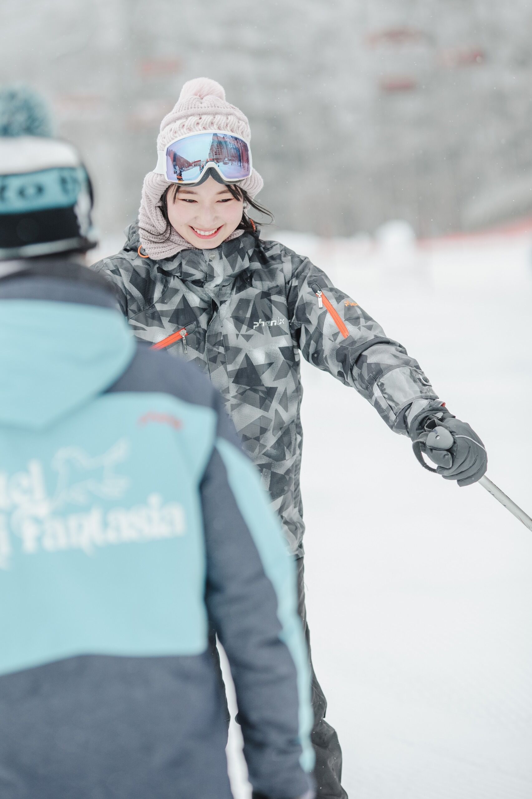 A person skiing with a guide.
