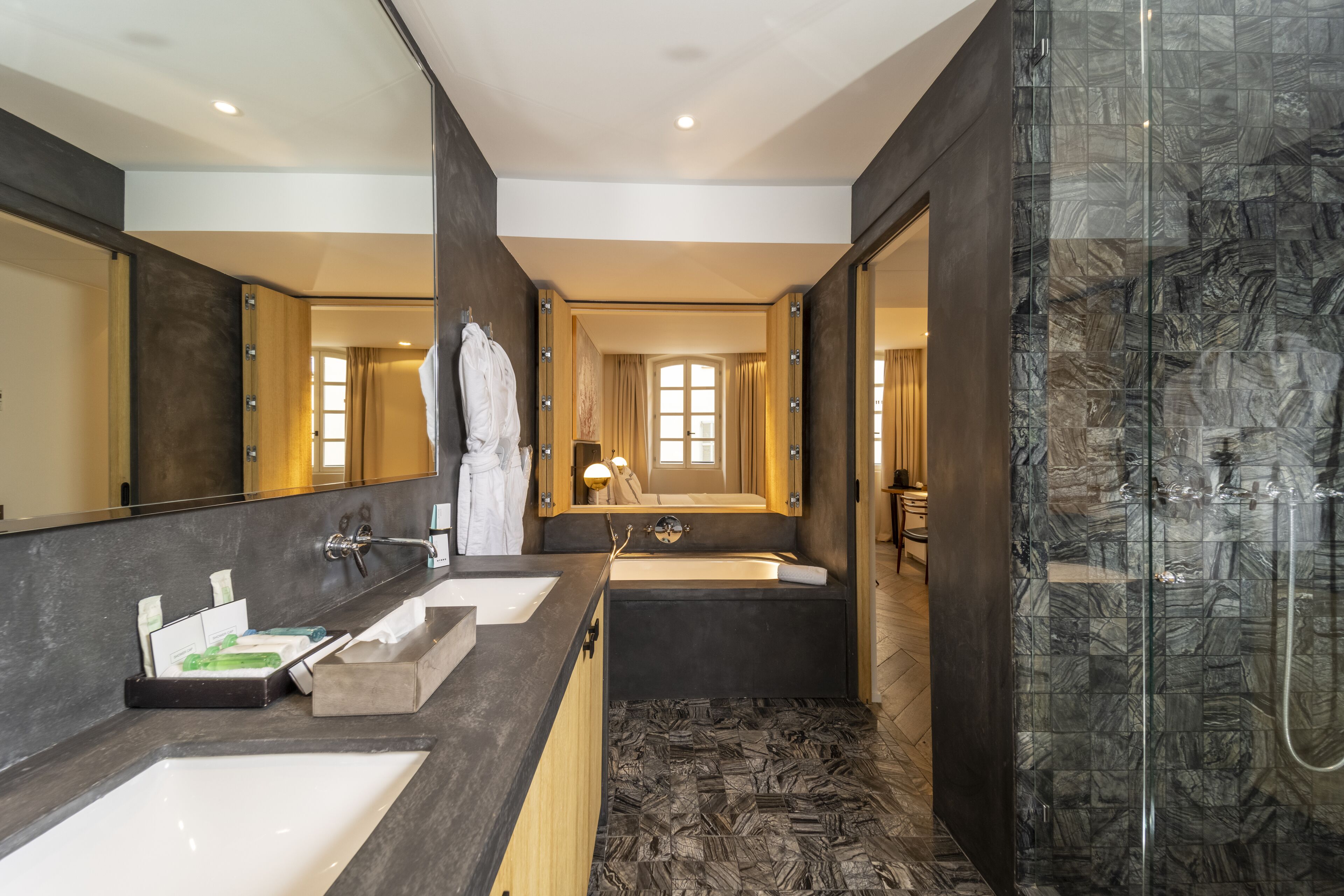 deluxe room | bathroom | designer toiletries, hair dryer, bathrobes, slippers