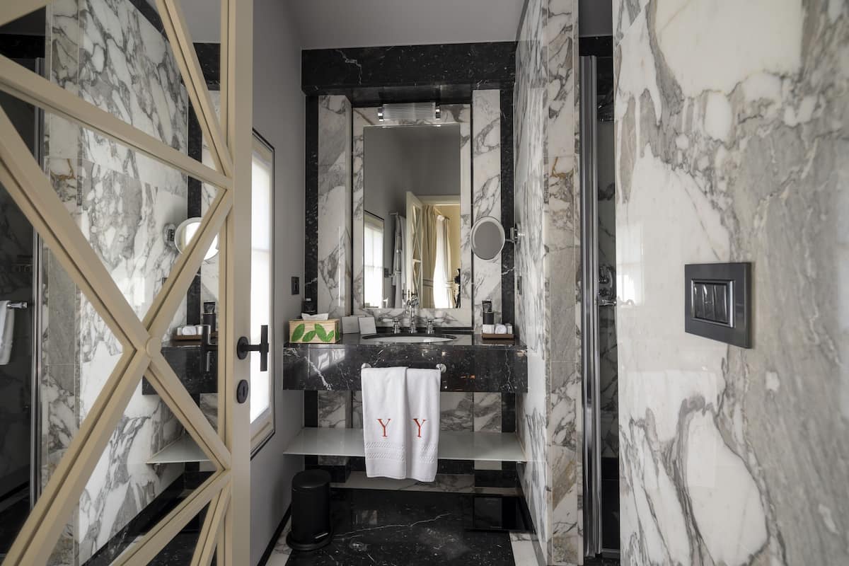 designer toiletries, hair dryer, bathrobes, slippers