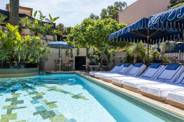 Outdoor pool, open 7:30 AM to 6:00 PM, free pool cabanas, pool umbrellas