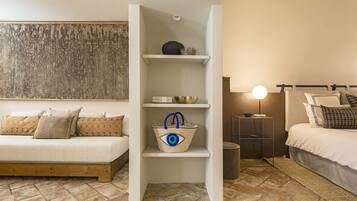 Cozy retreat with a wooden bed, white headboard, and stylish shelf.