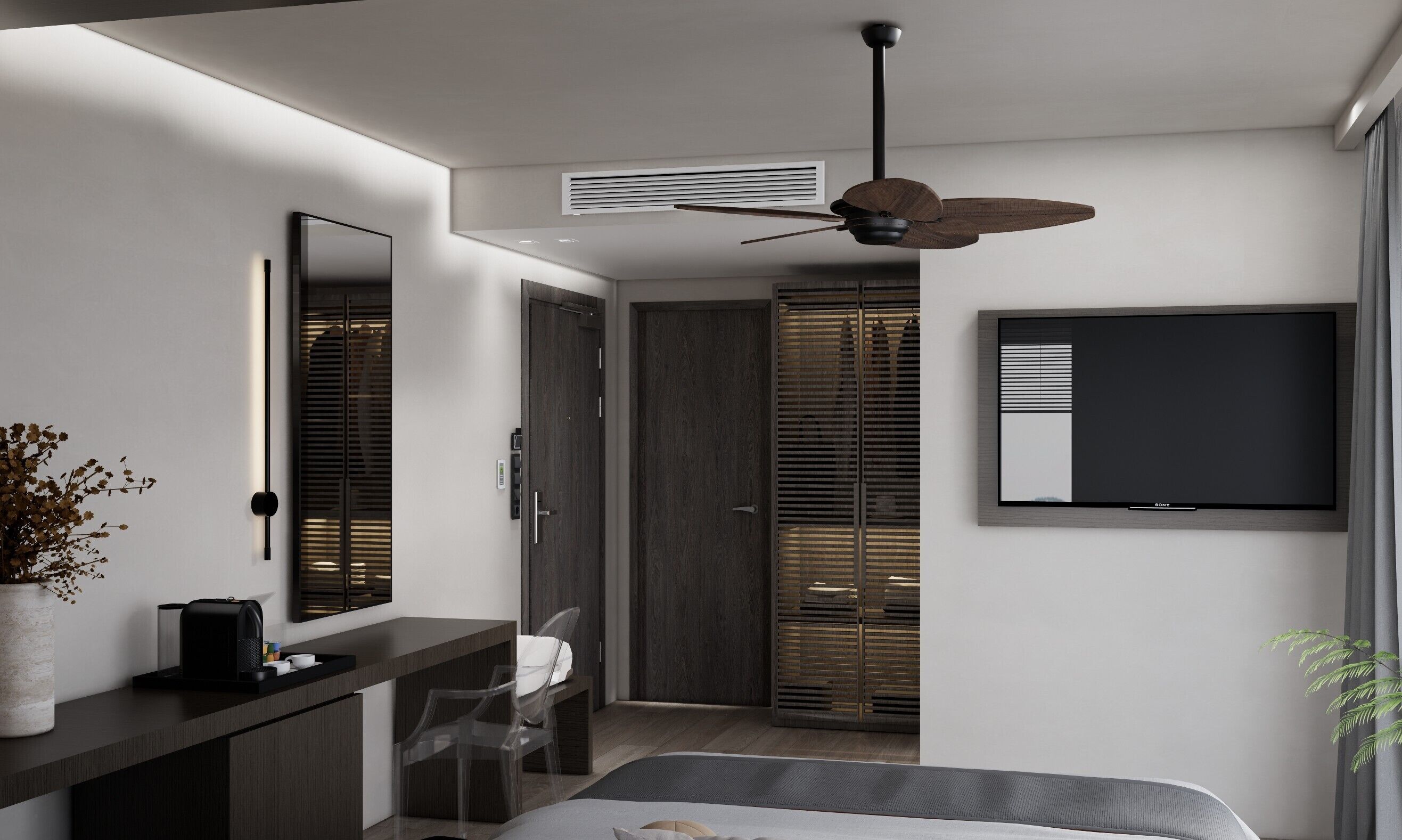 A modern bedroom with a bed, a desk, a chair, a TV, and a ceiling fan.