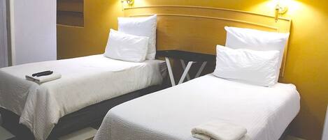 Standard Twin Room, Courtyard View | Desk, iron/ironing board, free cribs/infant beds, free WiFi