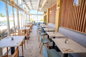 Breakfast, lunch, dinner served; international cuisine, pool views