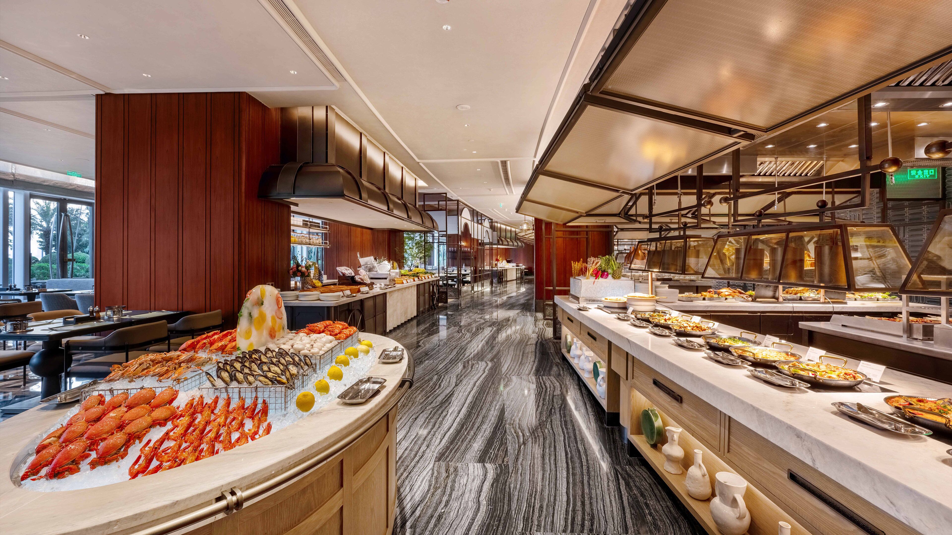 A buffet with seafood, fruits, and vegetables.