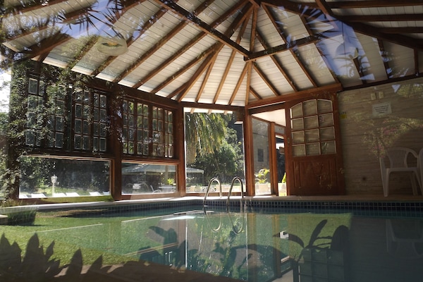 Indoor pool, outdoor pool, pool umbrellas, sun loungers