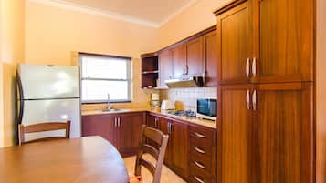 Comfort Studio, 1 King Bed, Kitchen, Beachfront | Private kitchen | Full-sized fridge, microwave, stovetop, coffee/tea maker