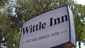 A sign for Wittle Inn with the text "Wittle Inn Established 1938". - Wittle Inn (Sunnyvale)