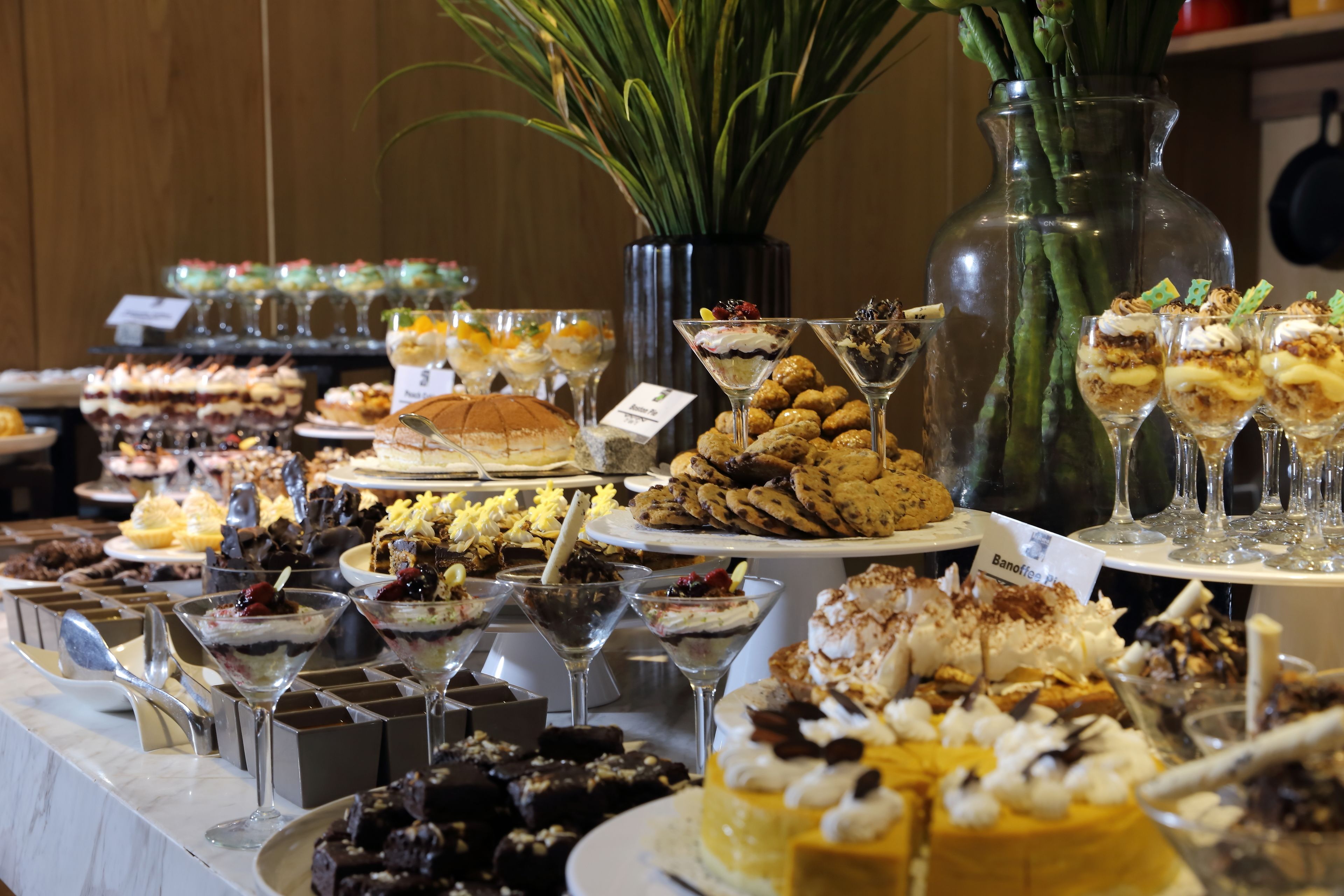 A buffet with various desserts and drinks.