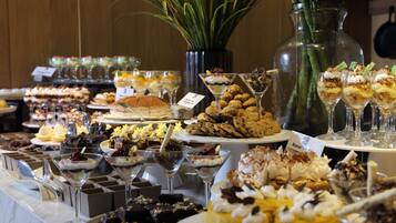 A buffet with various desserts and drinks.
