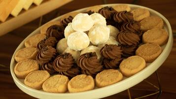 A plate of assorted cookies and chocolate treats.