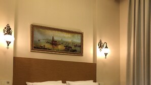 A neatly made bed with white linens in a hotel room. - Ottoman's Pearl Hotel (Istanbul)