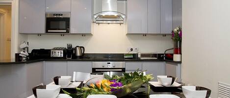 Luxury Apartment, 2 Bedrooms, Ground Floor | Private kitchen | Full-sized fridge, microwave, stovetop, dishwasher
