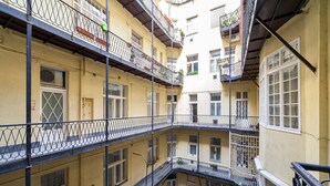 A multi-story building with balconies, windows, and a staircase. - Tatra 4 Studios (Budapest)