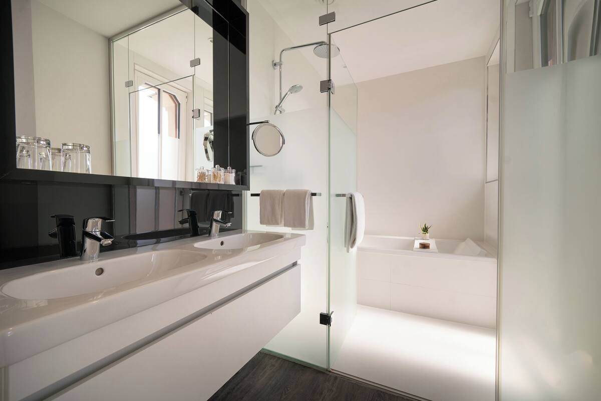 the innside premium room - xtra space | bathroom | shower, rainfall showerhead, designer toiletries, hair dryer