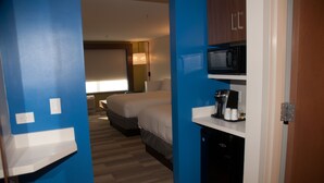 A hotel room with a bed, a microwave, a coffee maker, and a small kitchenette. - Holiday Inn Express & Suites Decatur by IHG (Decatur)