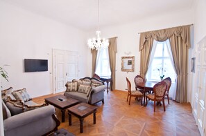 Luxury Suite, 2 Bedrooms, Connecting Rooms, Garden View | Living room | Flat-screen TV