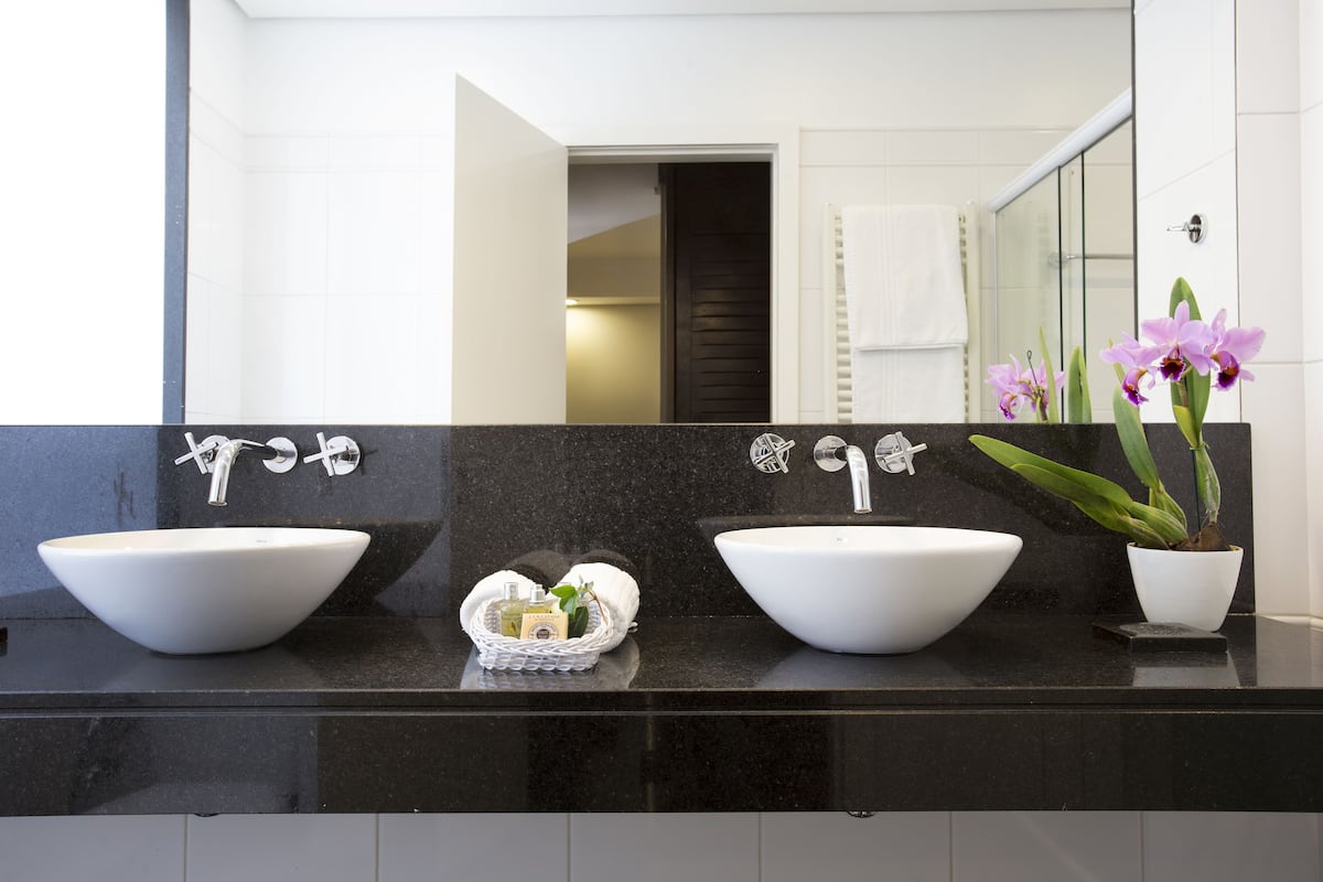 designer toiletries, hair dryer, bathrobes, slippers