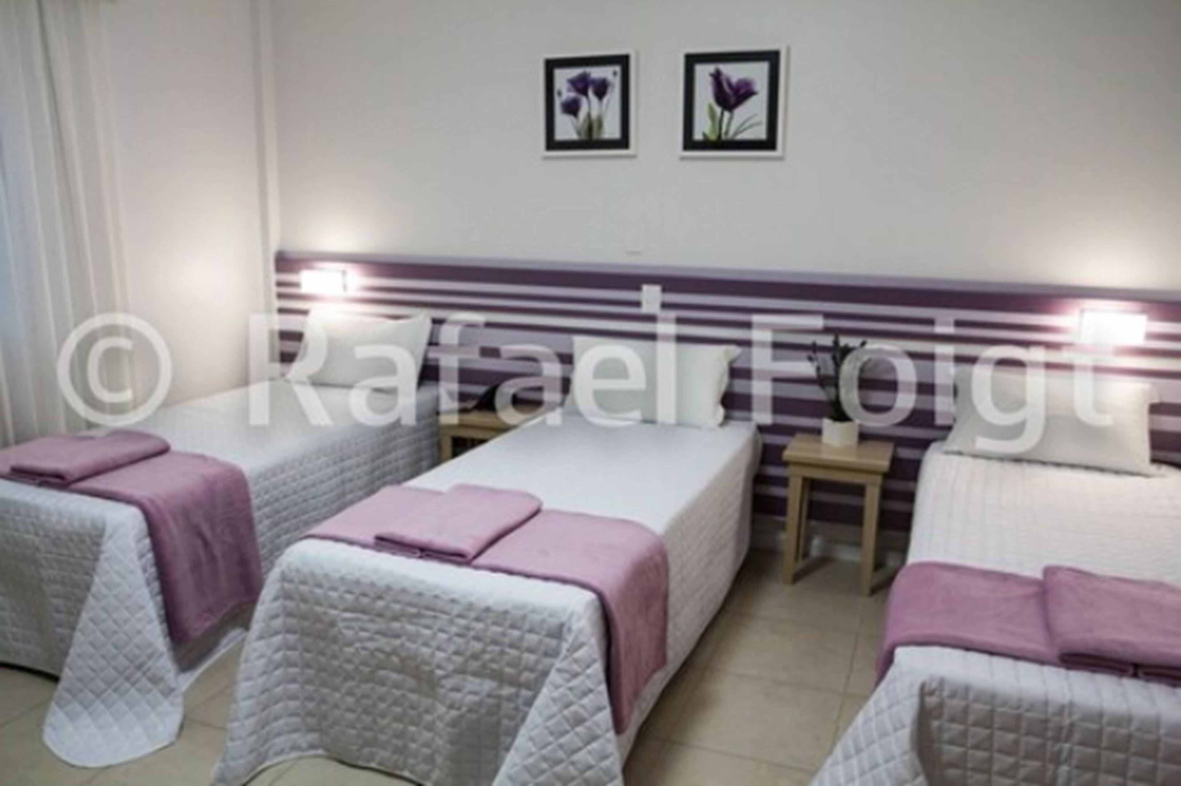 superior quadruple room | minibar, in-room safe, individually decorated, blackout curtains