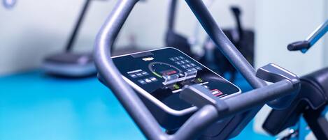 A stationary bike with a digital display and control panel.