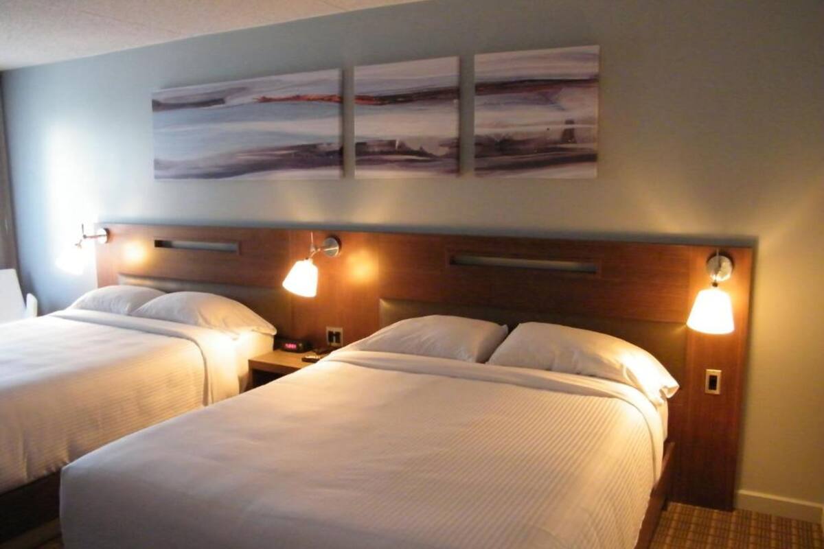 room, 2 double beds | premium bedding, desk, iron/ironing board, free wifi