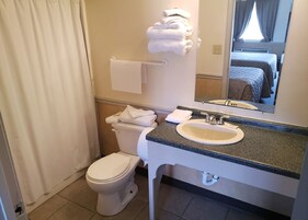 Combined shower/tub, hair dryer, towels, soap