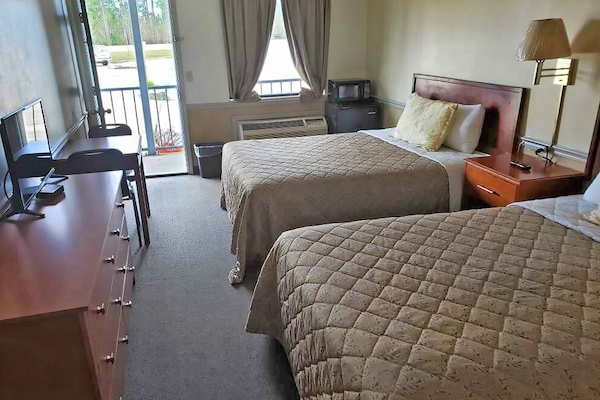 Blackout drapes, iron/ironing board, free rollaway beds, free WiFi