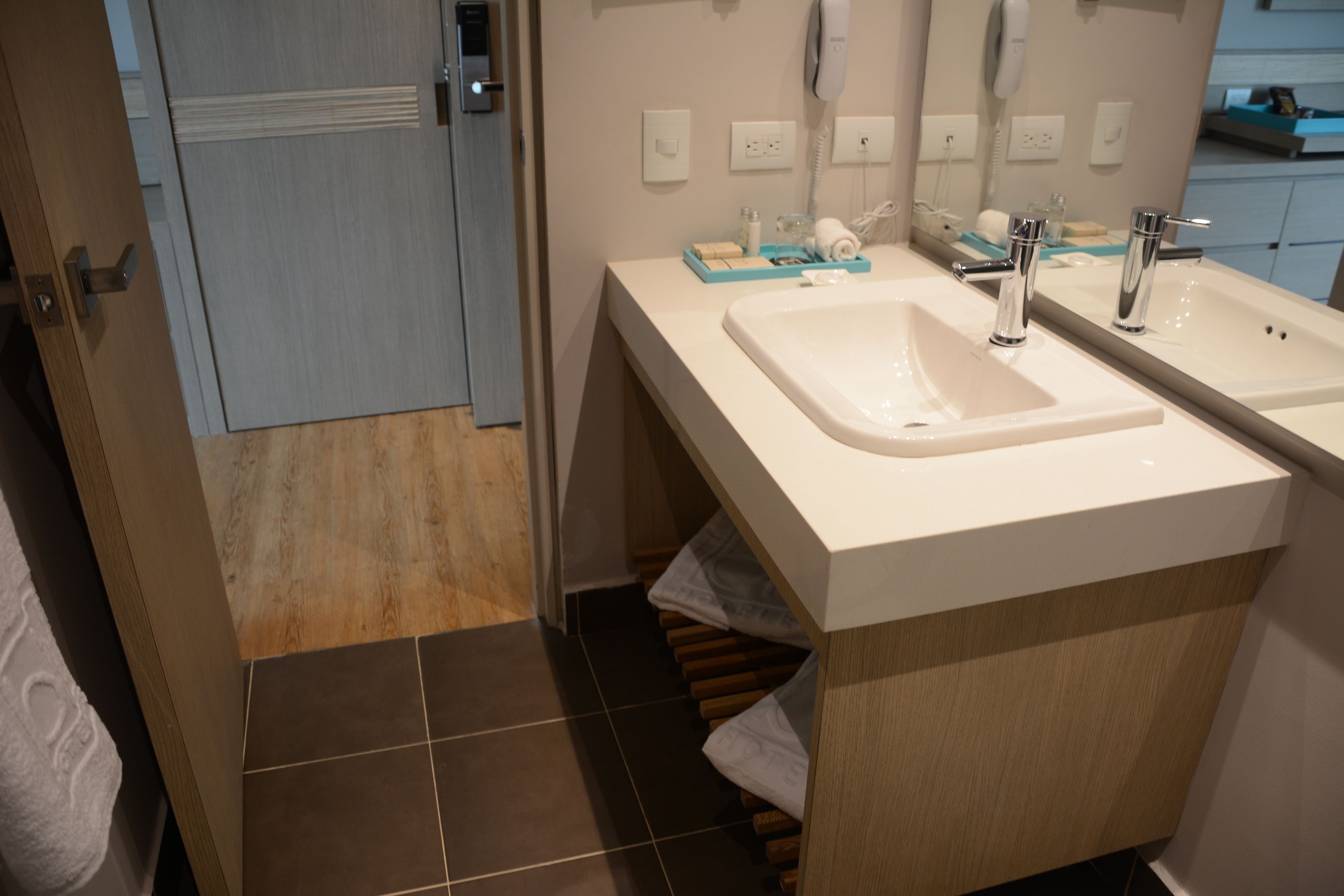 rainfall showerhead, eco-friendly toiletries, hair dryer, towels