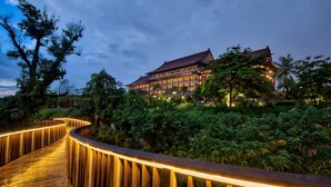 A traditional building with multiple levels and a wooden walkway leading to it. - The Grand Hotel Kaohsiung (Kaohsiung)