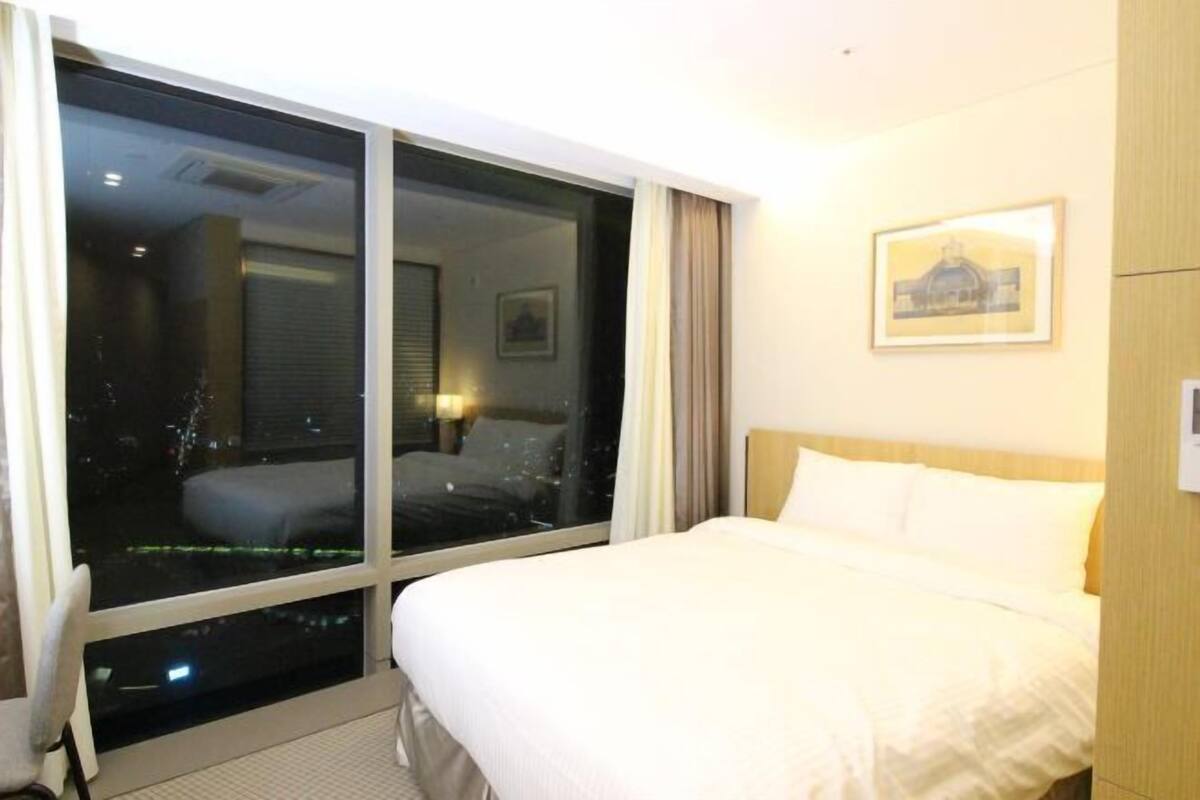 Premium bedding, down duvets, in-room safe, desk