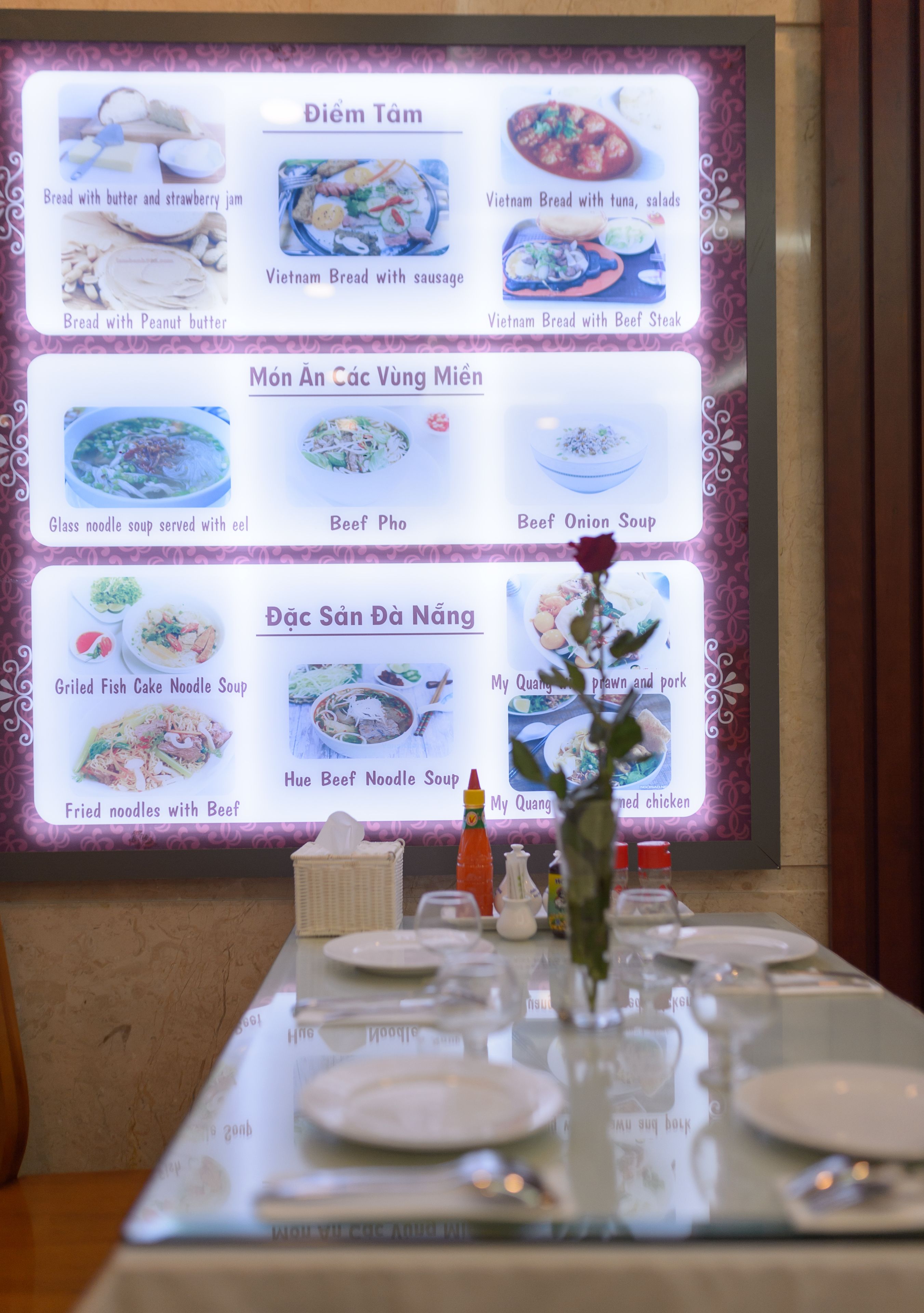 A restaurant menu with various Vietnamese dishes.