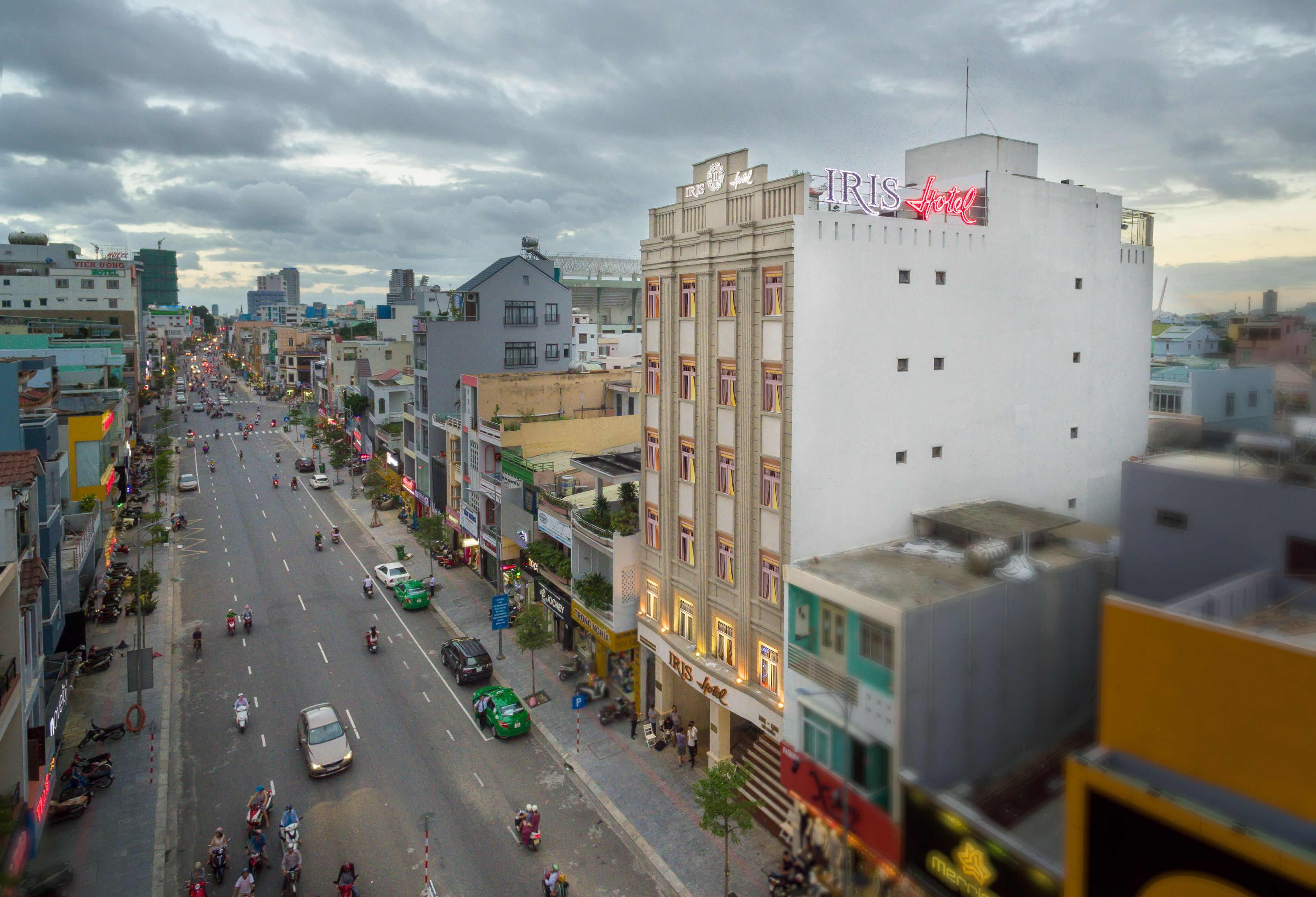 A hotel with a prominent sign on the building.