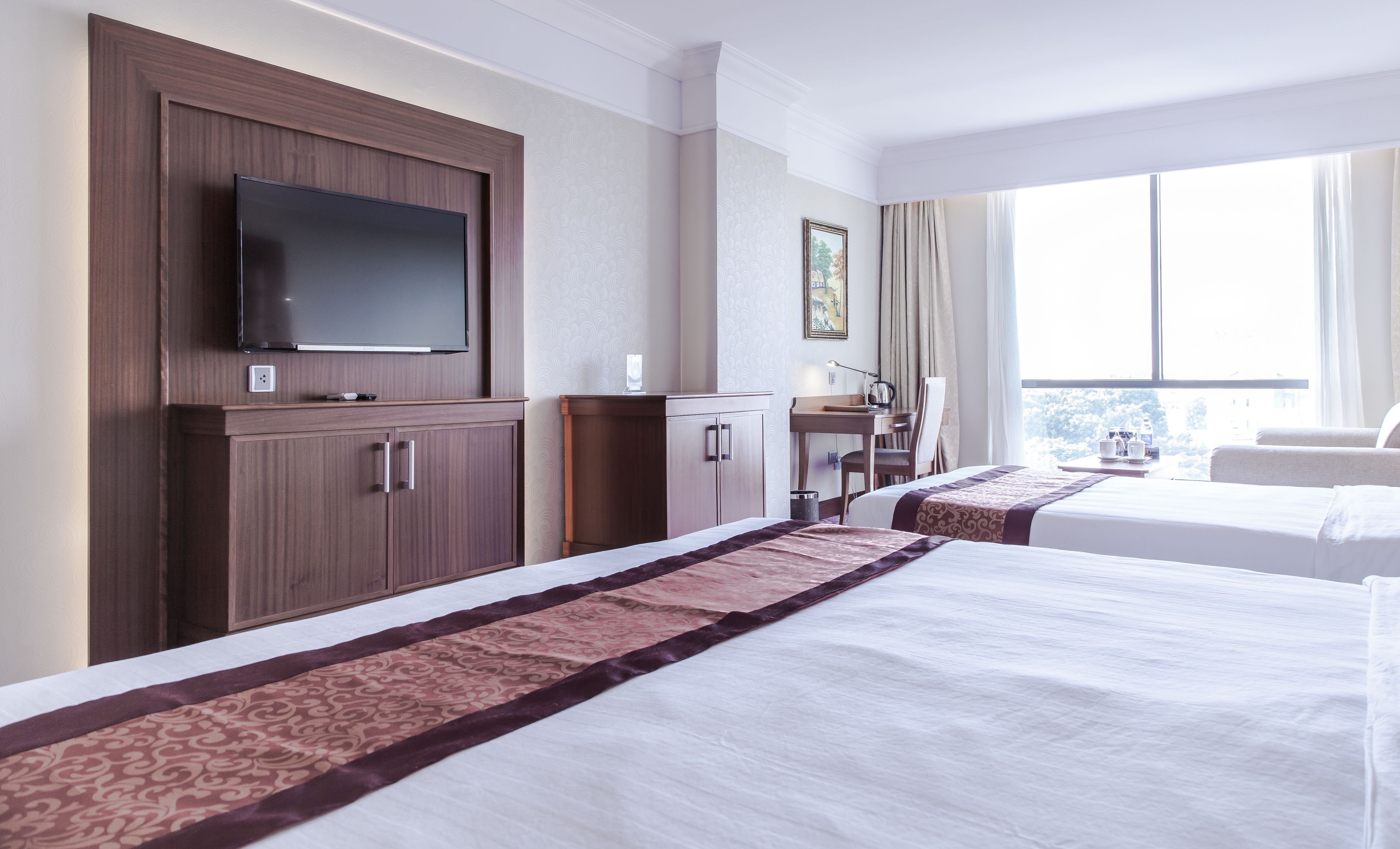 twin room | minibar, in-room safe, desk, blackout curtains