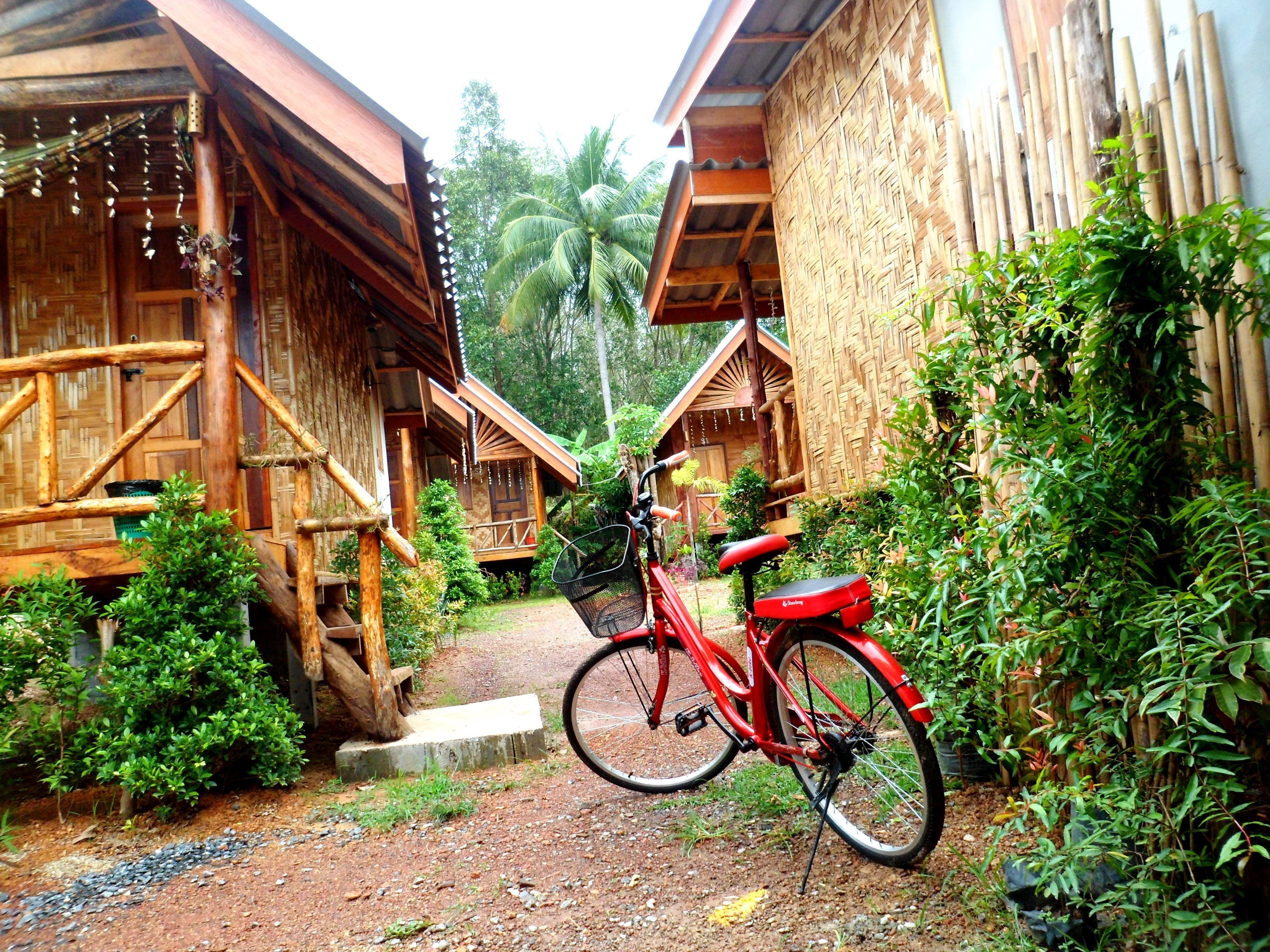A wooden building with a bicycle parked in front.