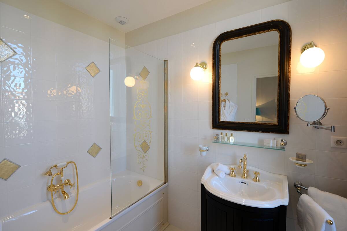 junior suite | bathroom | designer toiletries, hair dryer, bathrobes, towels