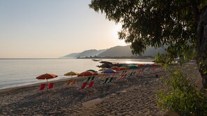 On the beach, beach umbrellas - Testa di Monaco Natural Beach  (Capo d'Orlando)