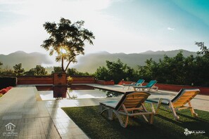 Outdoor pool, pool umbrellas, sun loungers