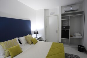 Luxe beddengoed, een minibar met enkele gratis items