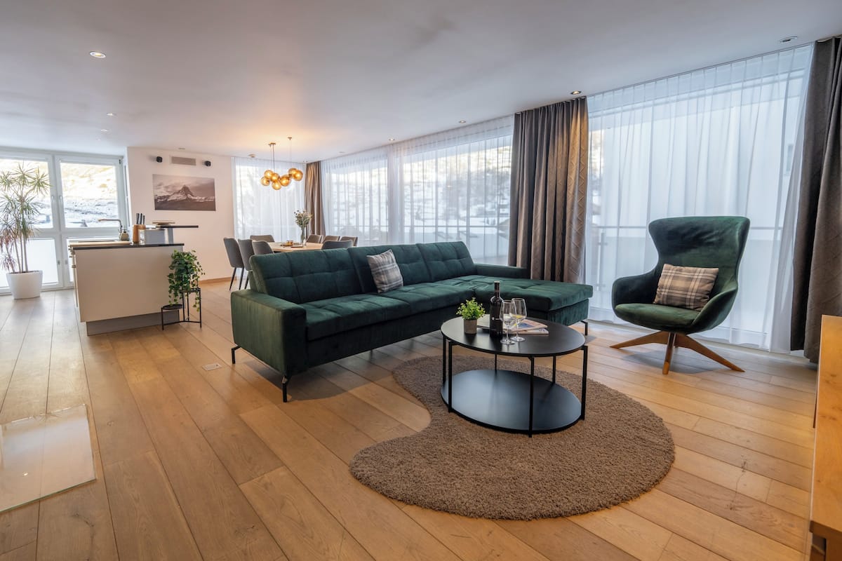 Exclusive Apartment, 3 Bedrooms | Living area | 110-cm flat-screen TV with cable channels, TV, fireplace